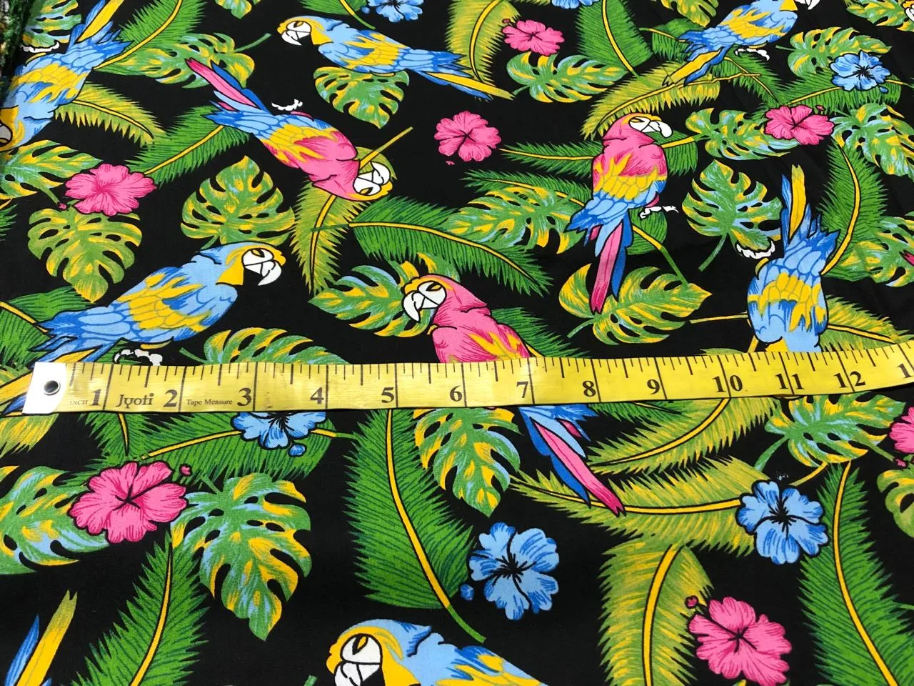 100% Cotton Poplin PRINT   58" wide RETRO BEACH available in 4 different prints pink ,orange, blue ,yellow ,green waves / black jungle with pink and blue parrots and flowers / blue with lavender pink flowers and black and white floral