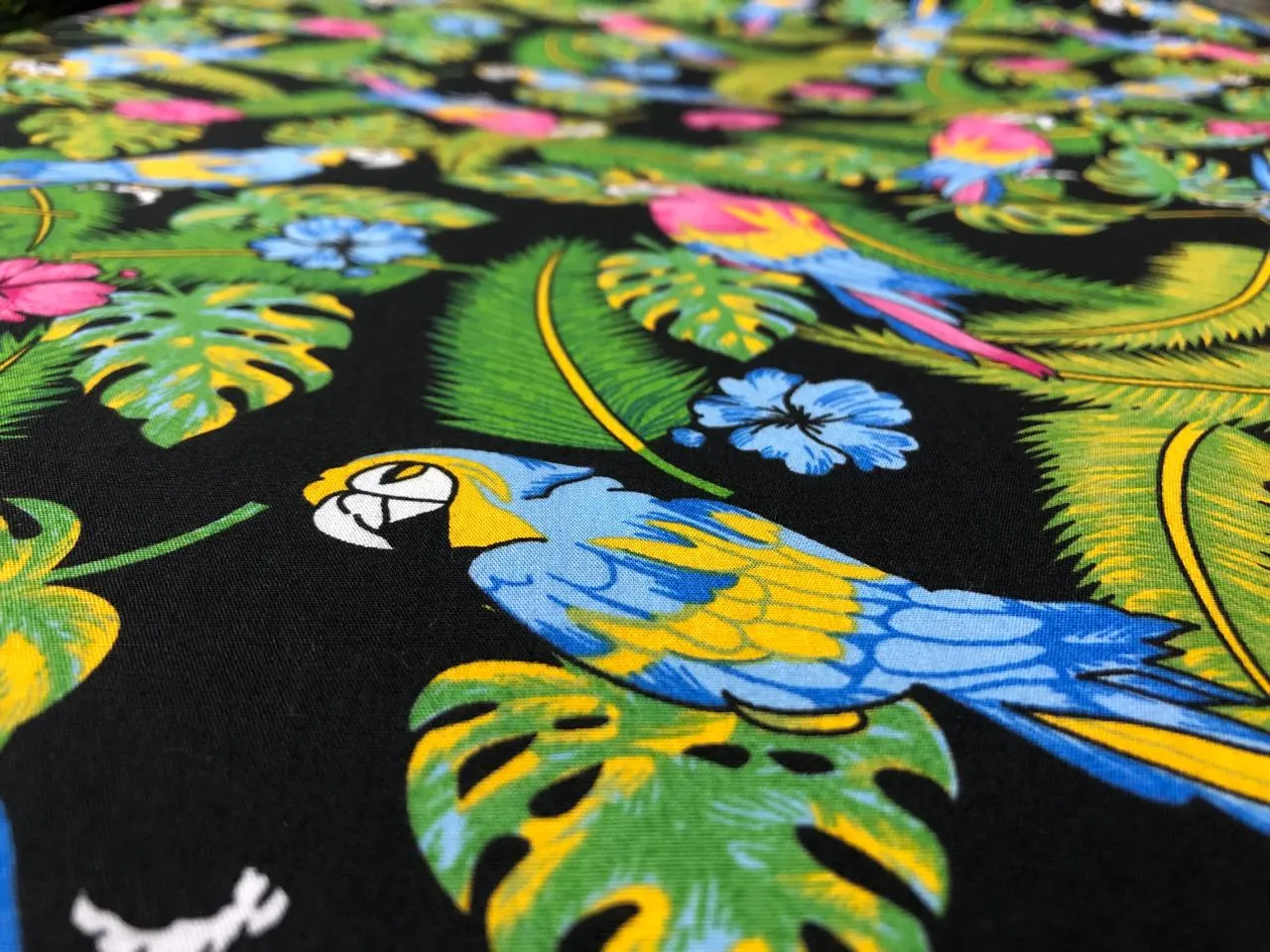 100% Cotton Poplin PRINT   58" wide RETRO BEACH available in 4 different prints pink ,orange, blue ,yellow ,green waves / black jungle with pink and blue parrots and flowers / blue with lavender pink flowers and black and white floral